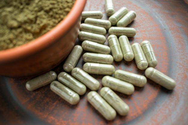 supplement kratom green capsules powder brown plate 72482 183